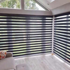 Zebra blind curtain installed on large living room windows for stylish light control and privacy.