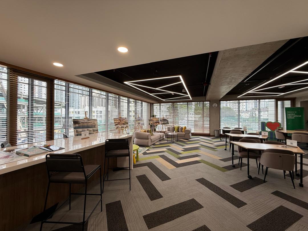 Wooden venetian blinds installed across large classroom windows, providing refined daylight control, privacy, and a professional interior finish.