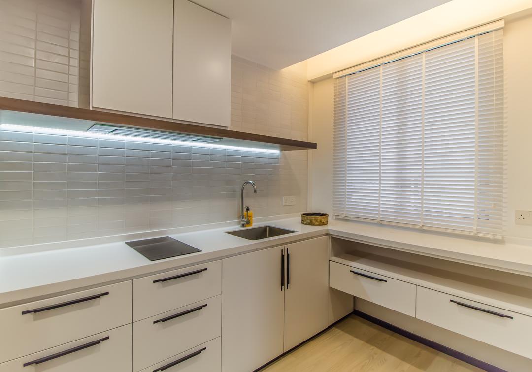 Wooden venetian blinds fitted in a bright modern kitchen, adding clean privacy, soft daylight control, and a refined window finish.